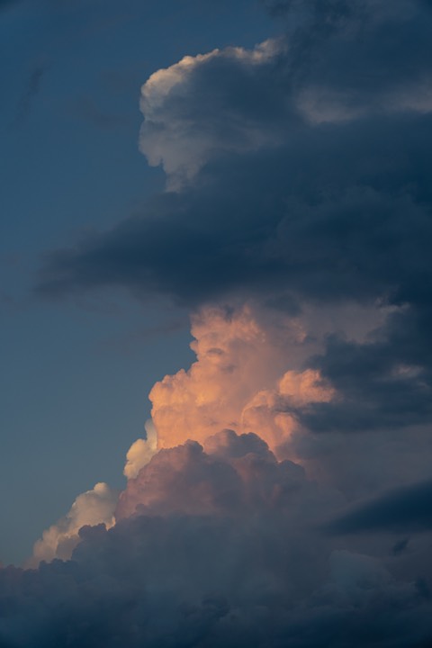 Towering cumulus lit pink at sunset