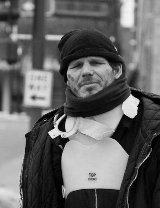Portrait of a man on a winter street corner